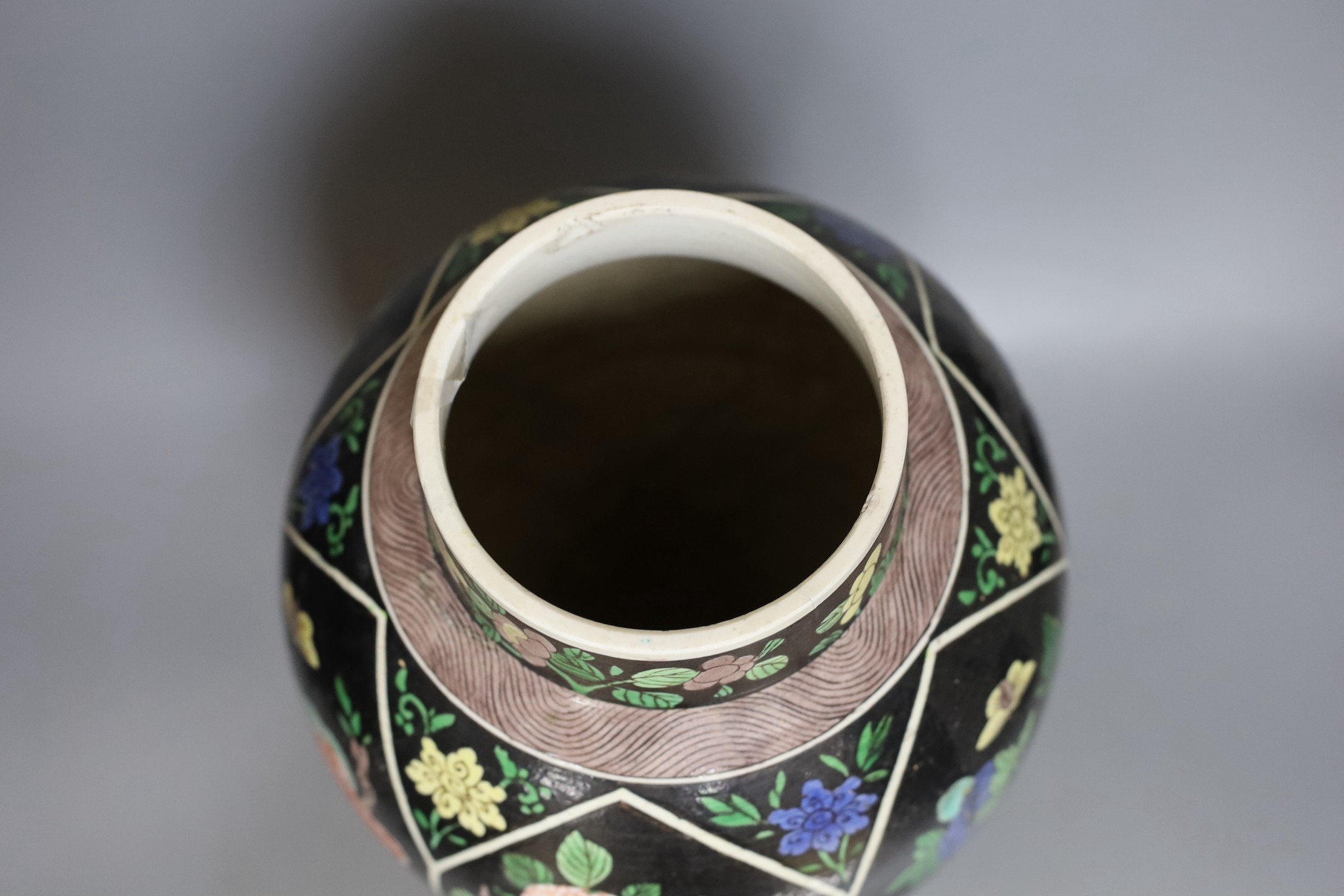 A late 19th century Chinese famille noire enamelled biscuit baluster vase and cover, 49cm high